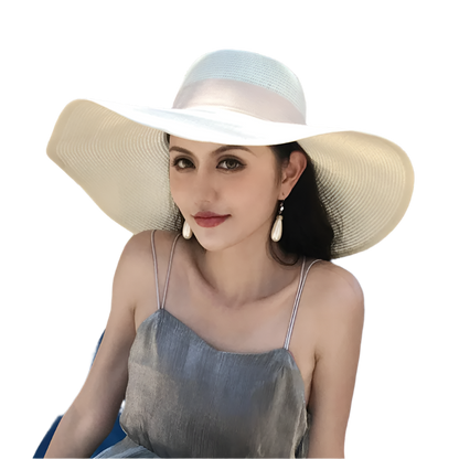 Woman wearing a wide-brimmed hat sitting on a blue chair outdoors.