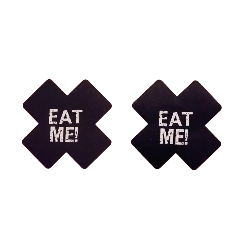 Black earrings with 'EAT ME!' text on a pink background