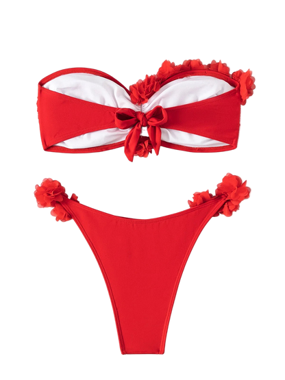 Red bikini set with floral details on a white background