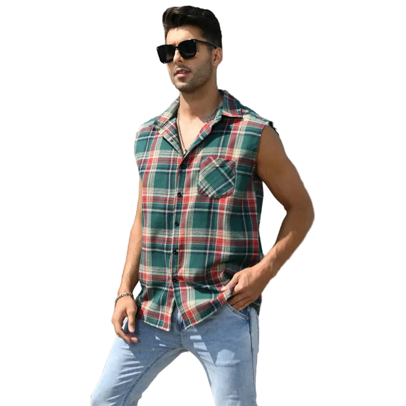 Man wearing a plaid sleeveless shirt and sunglasses standing on steps in front of a building.