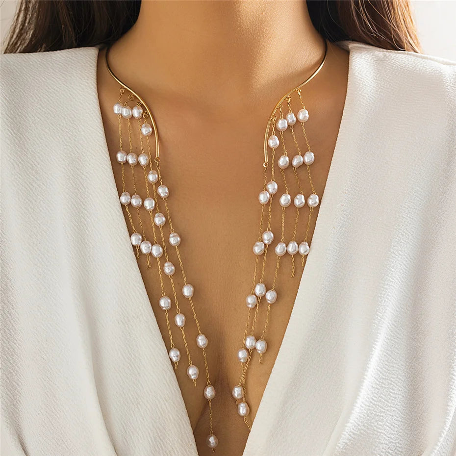 Pearl necklace draped over a white garment