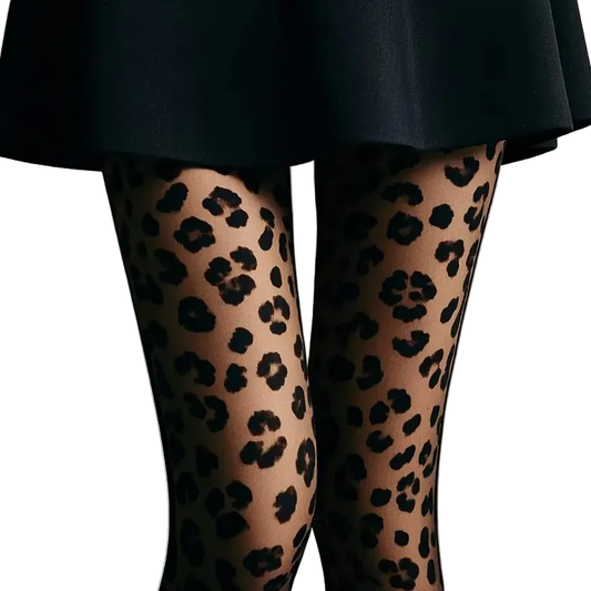 Close-up of a person's legs wearing sheer black leopard-print tights, paired with a dark skirt against a plain light gray background.