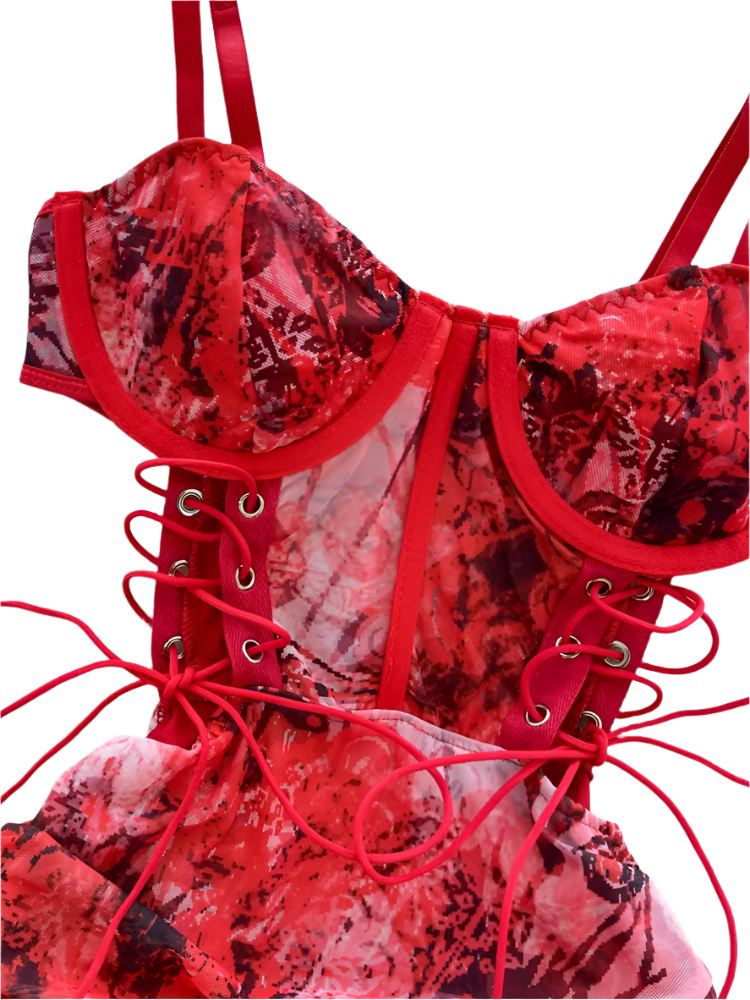 Red lace-up lingerie set on a white surface 