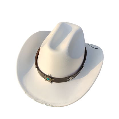 White cowboy hat with a brown band featuring a turquoise stone on grass