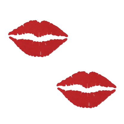 Two round beige placemats featuring a bold red lip print design, arranged diagonally on a solid white background.