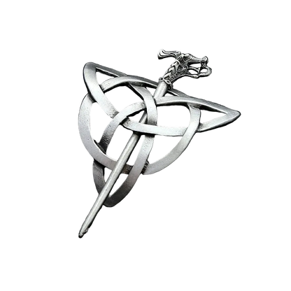 Silver Celtic knot brooch on a dark textured surface