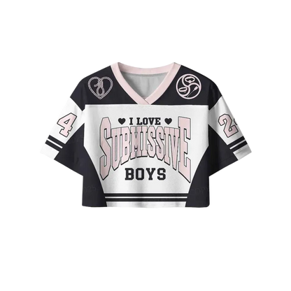 A cropped V-neck jersey-style top with a black, white, and light pink color scheme. The front features the text 'I LOVE SUBMISSIVE BOYS' with heart icons, and the sleeves display the numbers 4 and 2.