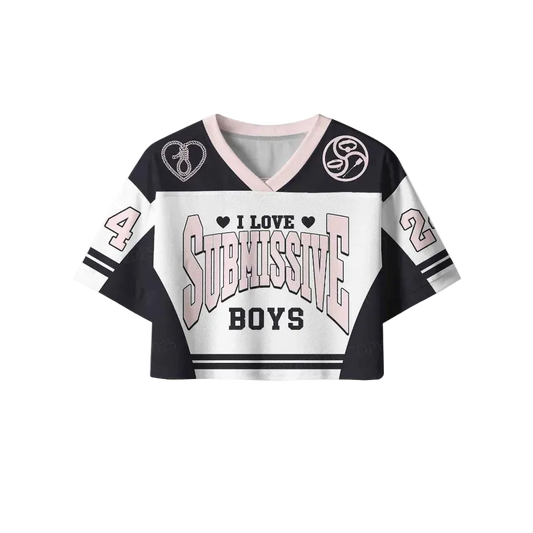 A cropped V-neck jersey-style top with a black, white, and light pink color scheme. The front features the text 'I LOVE SUBMISSIVE BOYS' with heart icons, and the sleeves display the numbers 4 and 2.