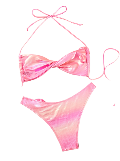 A shiny pink bikini with a wrap-style top and high-waisted bottoms. It includes decorative flower accents on the top and bottom, adding a playful touch.