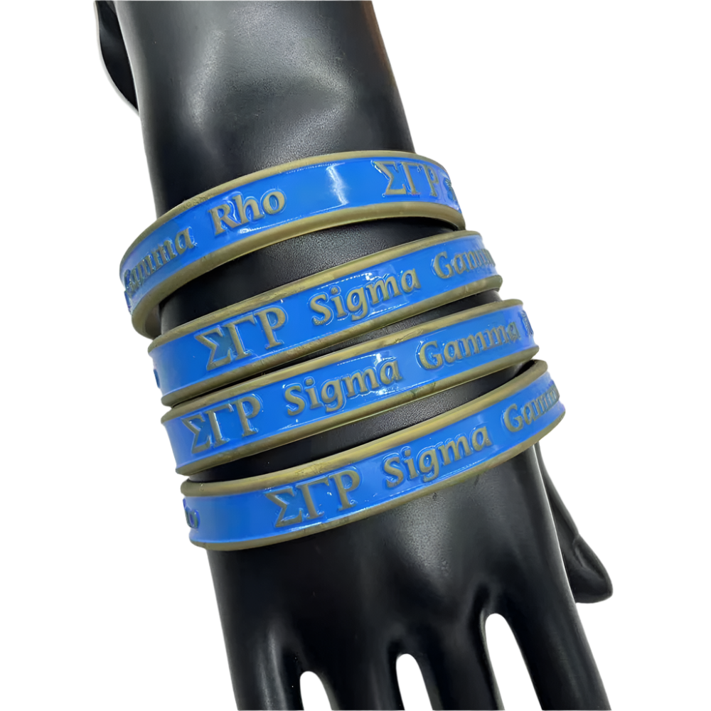 Set of blue and gold bracelets with Greek letters on a mannequin hand.