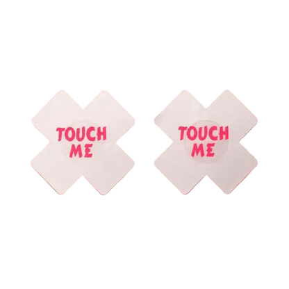 Two white diamond-shaped signs with 'TOUCH ME' text on a pink background