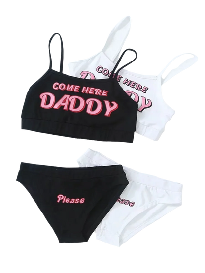 Loungewear Set: A black and white loungewear set with crop tops and matching bottoms. The tops have the text "COME HERE DADDY," and the bottoms say "Please," creating a playful and cheeky look.

