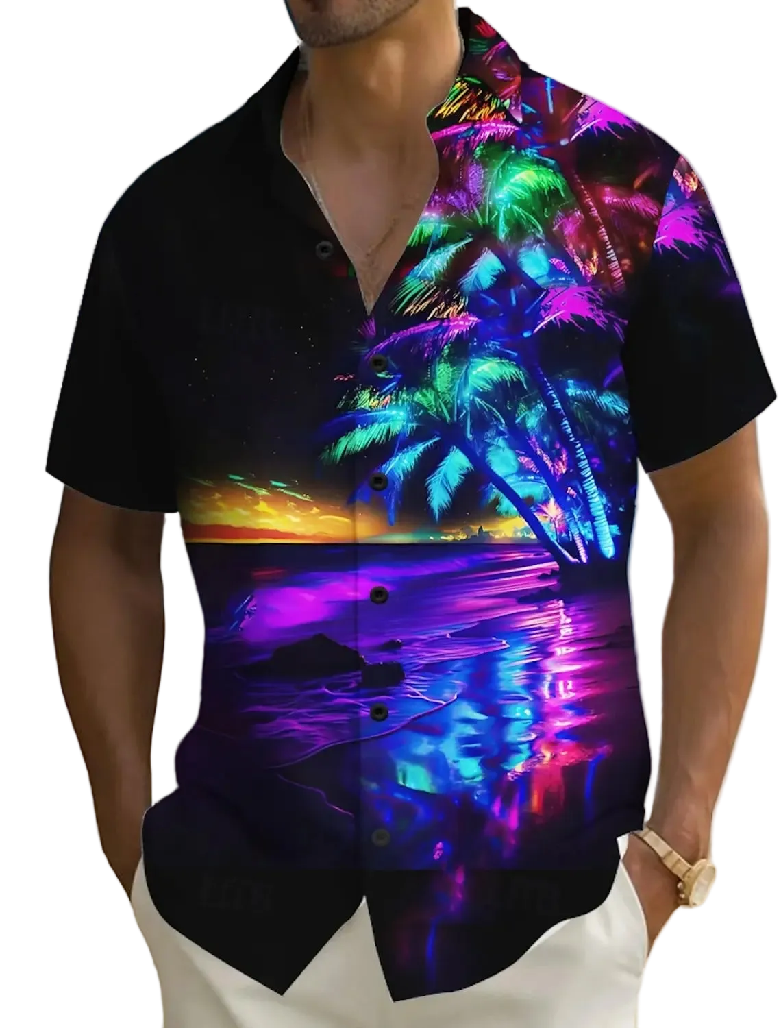 Man wearing a colorful beach-themed shirt with palm trees and sunset design on a beach.