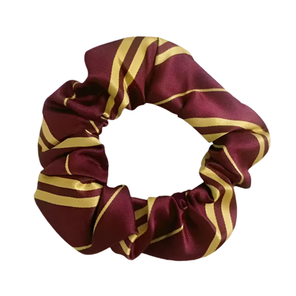 Maroon and gold striped scrunchie on a white background