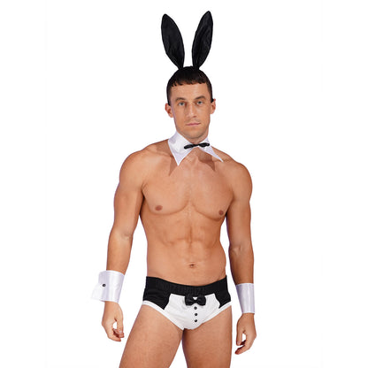 A man modeling a bunny costume set consisting of black and white bunny ears on a headband, a white collar with a black bow tie, white armbands, and white briefs with a black waistband.