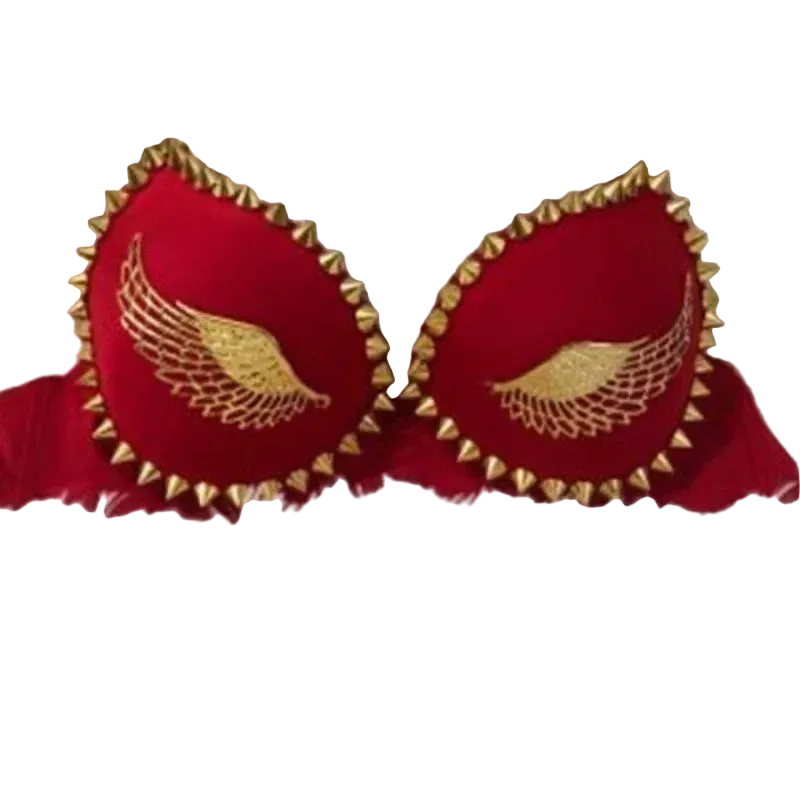 Red bralette with gold embroidered angel wings and gold spiked trim, displayed on a white faux fur background.