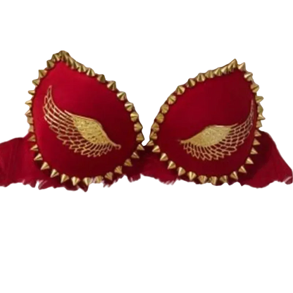 Red bralette with gold embroidered angel wings and gold spiked trim, displayed on a white faux fur background.