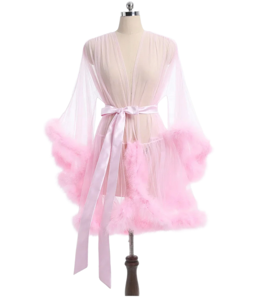 Sheer pink robe with fluffy trim and satin belt, perfect for luxurious resort lounging