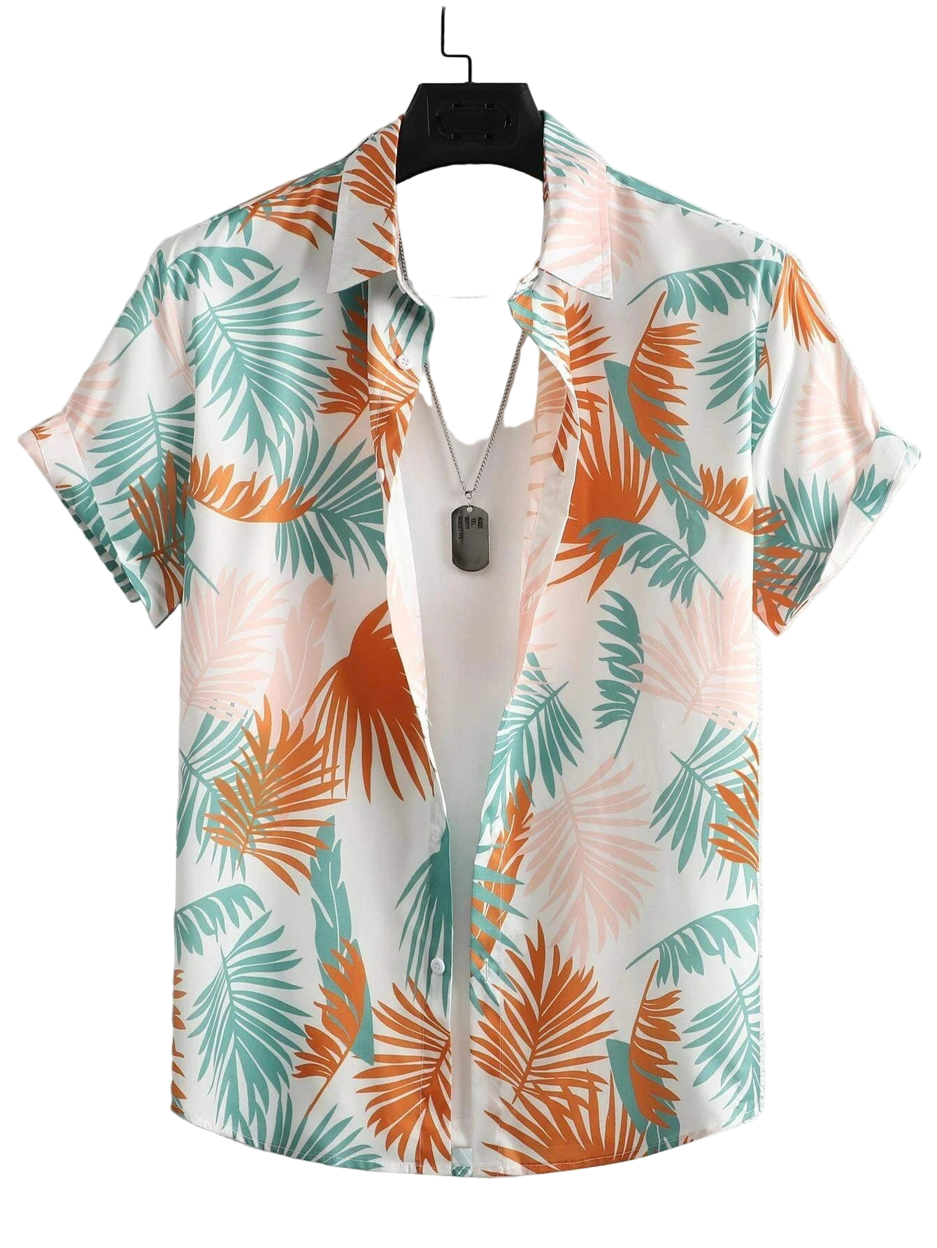 Short-sleeve shirt with tropical leaf pattern on a hanger against a light background