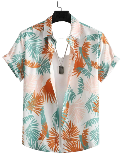 Short-sleeve shirt with tropical leaf pattern on a hanger against a light background