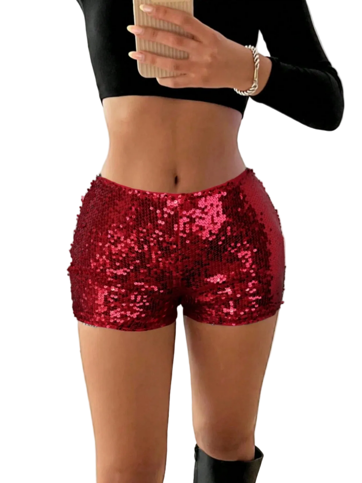 Person wearing red sequin shorts with a blurred indoor background