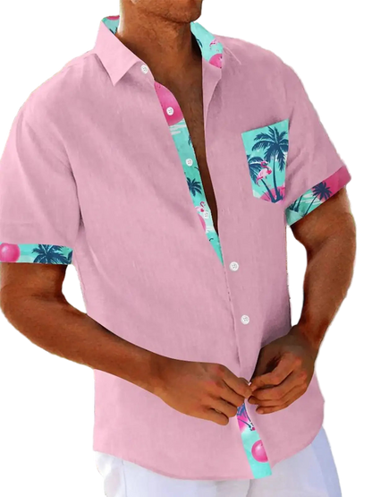 Person wearing a pink shirt with colorful collar and pocket design outdoors.