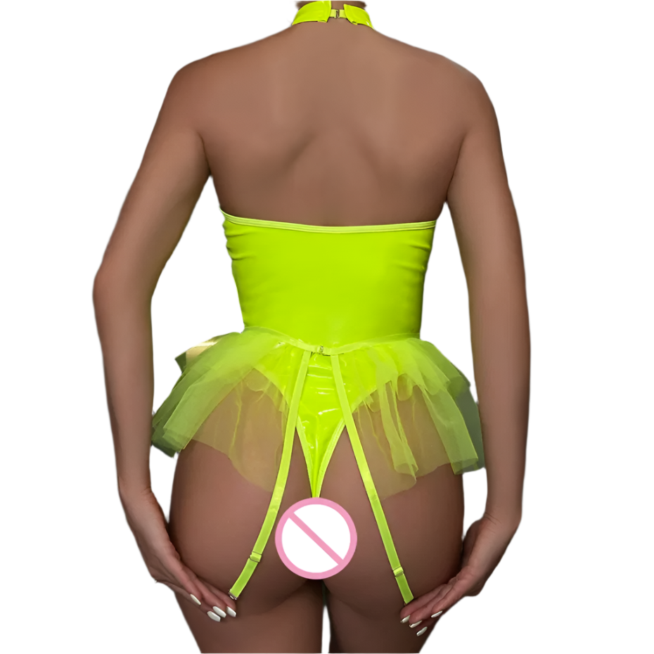 Person wearing a bright green tutu dress with a no entry sign on a dark background