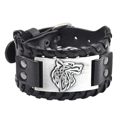 Black leather bracelet with metal wolf emblem on a white background