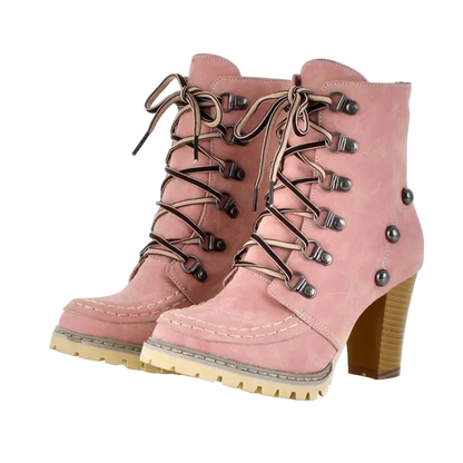 Pink lace-up boots with brown laces and buttons on a white background