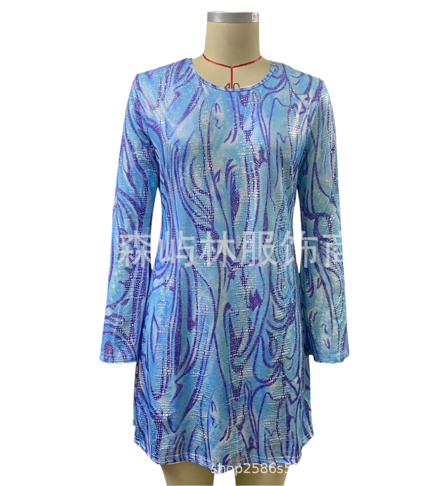 Disco Dress: A shimmering iridescent dress with long sleeves and a tie detail, perfect for a disco-themed party, paired with oversized sunglasses.

