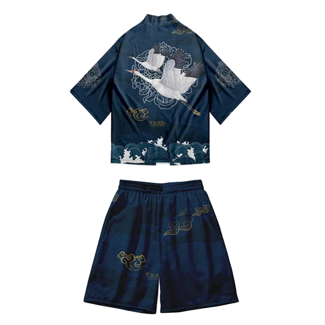 Navy blue traditional outfit with white and gold embroidery on a white background