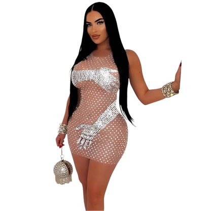 A sheer, form-fitting dress adorned with rhinestones and a unique design featuring hands. The dress is complemented by sparkling accessories, creating a glamorous and eye-catching appearance.