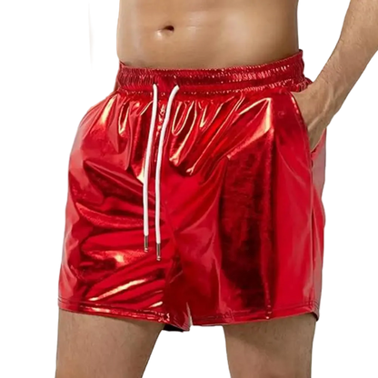 Red shiny vinyl swim trunks with a white drawstring, shown on a model against a white background.