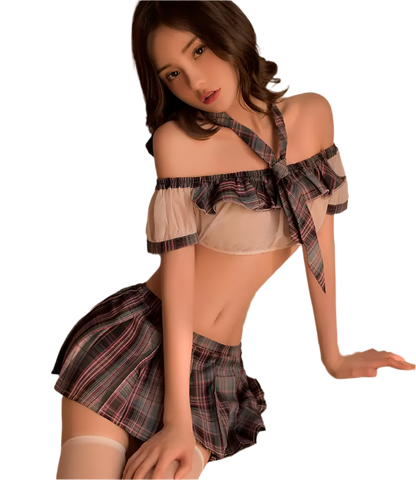 Woman in a plaid outfit sitting on a wooden stool with an open book.