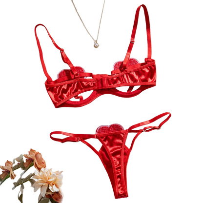 Red lingerie set with floral decorations on a light background