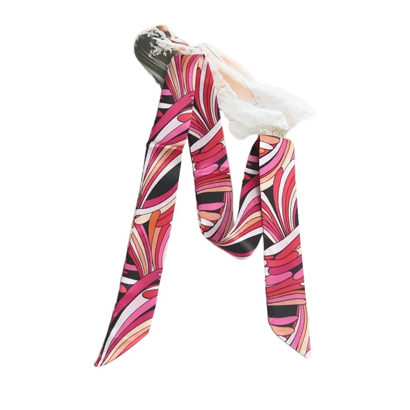 Colorful patterned scarf on a white surface