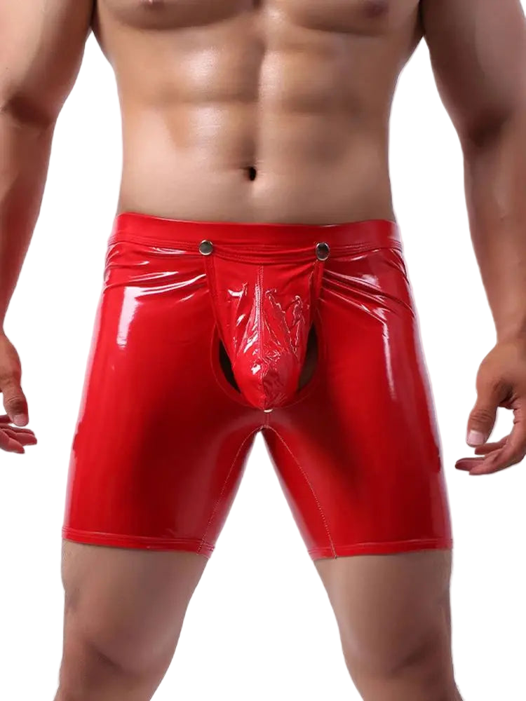 Red vinyl shorts worn by a person on a white background