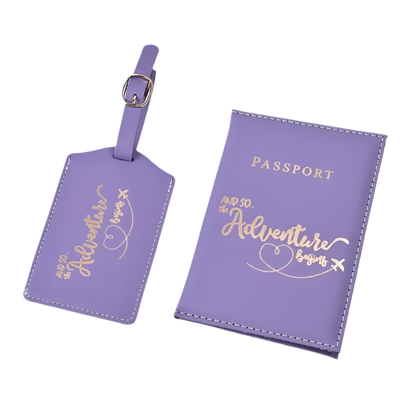 A passport holder and luggage tag set with the phrase "And so the adventure begins" in elegant script. The design is sleek and stylish, perfect for travel.