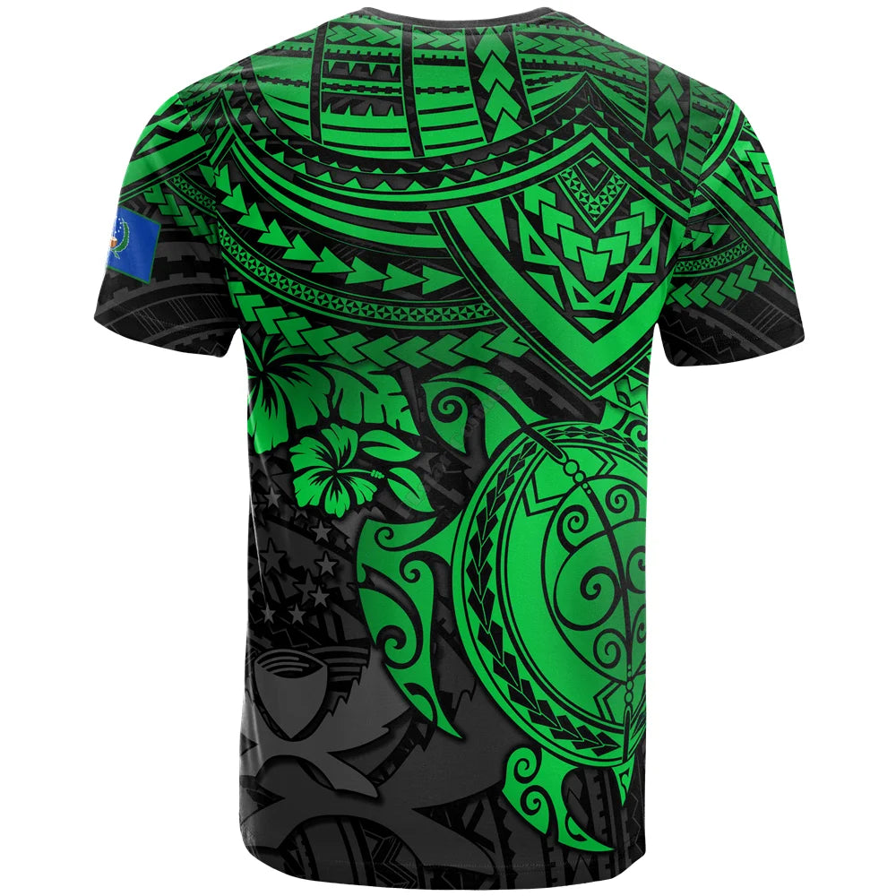 Green and black tribal-patterned t-shirt with turtle and floral designs.