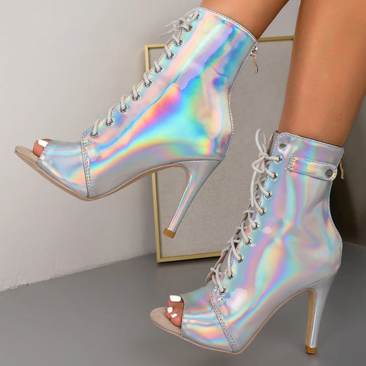 Holographic lace-up ankle boots with peep toes and stiletto heels. The iridescent finish gives them a futuristic and trendy appearance, ideal for making a fashion statement.