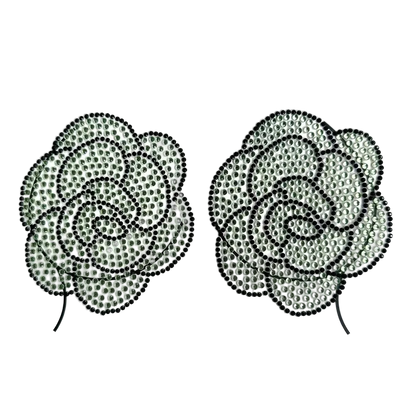 Pair of rose-shaped earrings with rhinestone embellishments on a white background