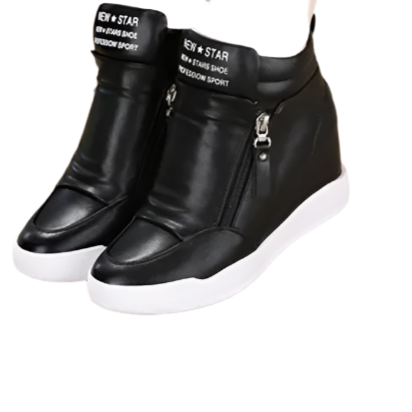 Black wedge sneakers with white soles worn by a person on a beige surface.