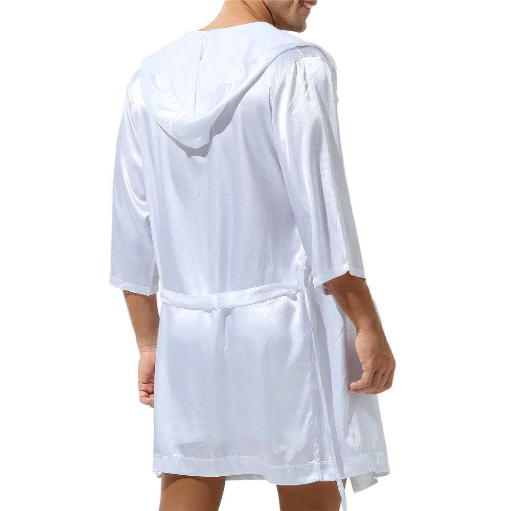 White hooded robe worn by a person on a white background