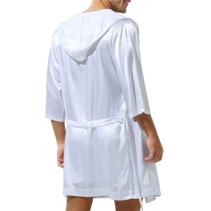 White hooded robe worn by a person on a white background