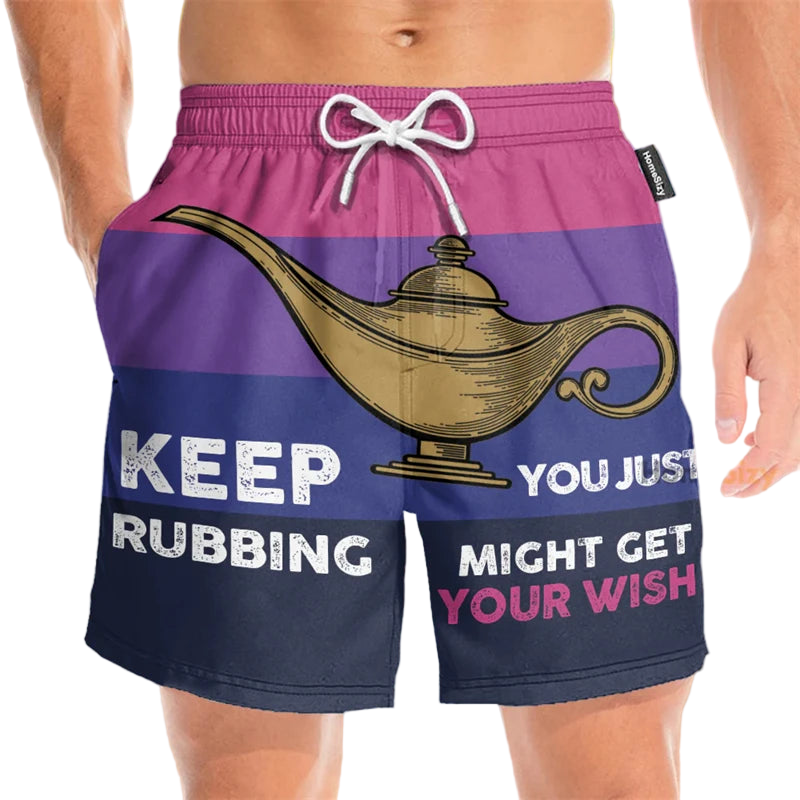 Beach shorts with a genie lamp design and humorous text on a beach background