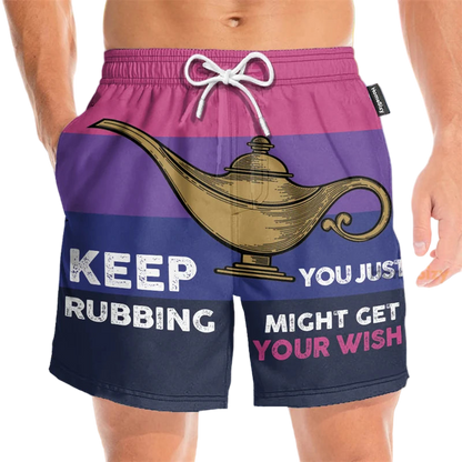 Beach shorts with a genie lamp design and humorous text on a beach background