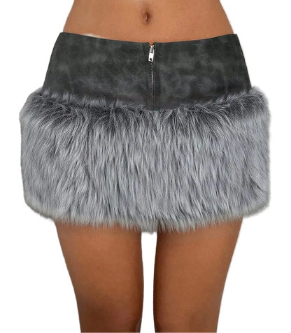 A gray faux fur mini skirt with a dark gray faux suede waistband and a silver zipper, shown on a model.