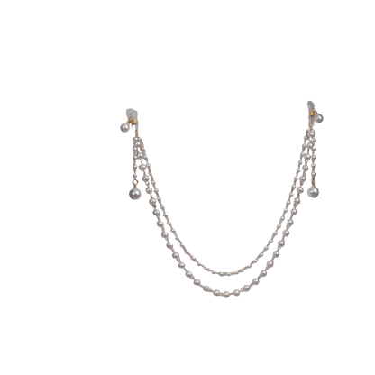 Pearl necklace on a mannequin with a black background