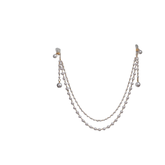 Pearl necklace on a mannequin with a black background