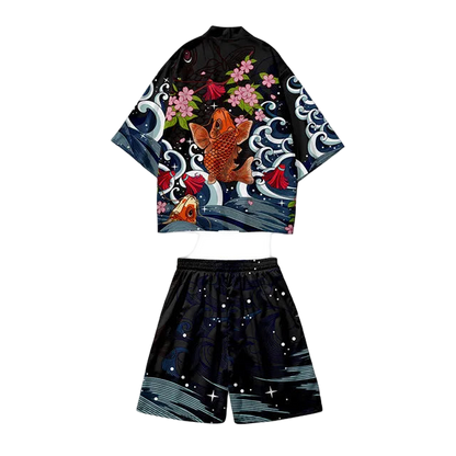 Set of black kimono-style top with fish and floral design and black shorts with star pattern on a white background.